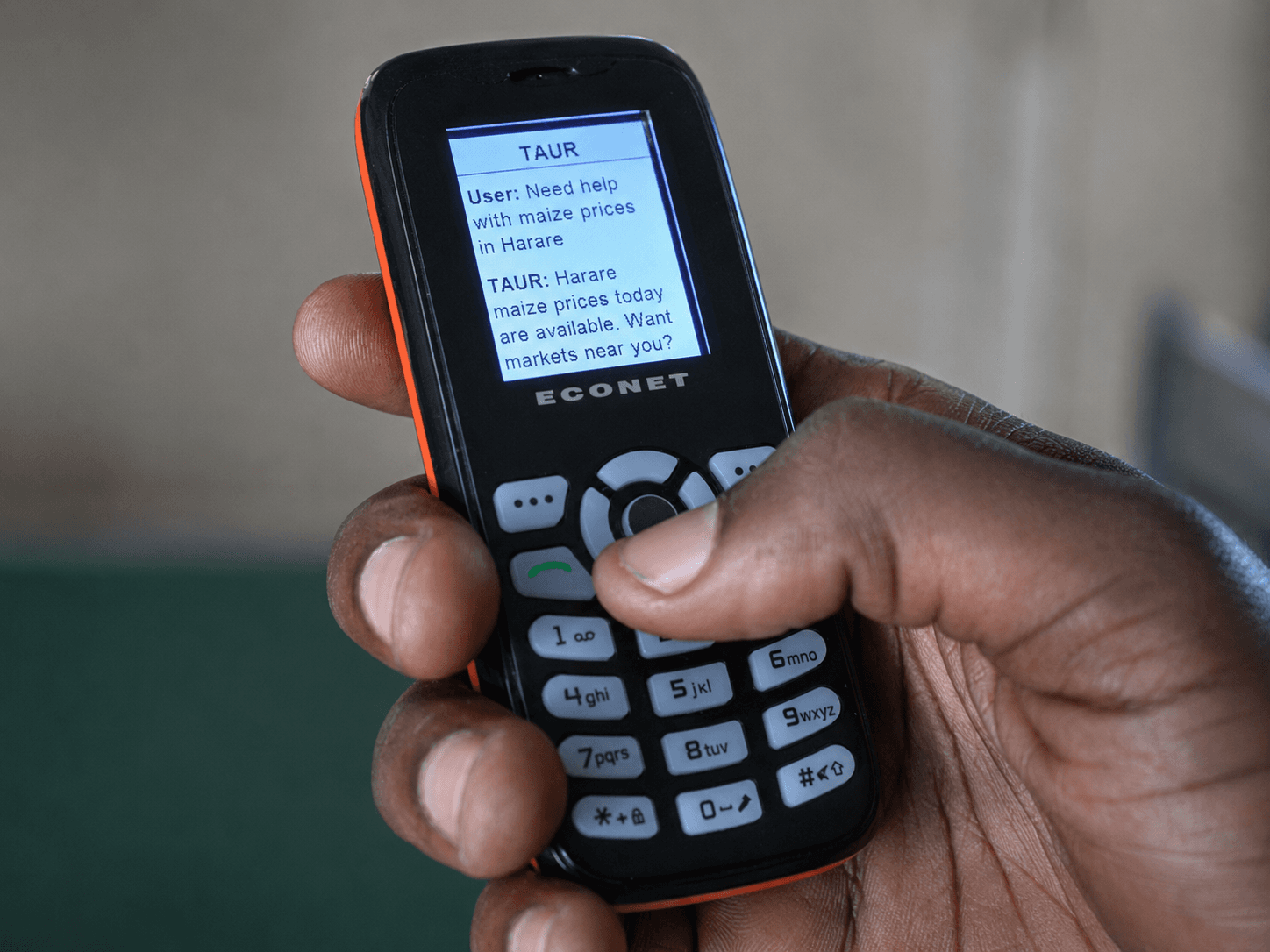 Feature phone showing TAUR conversation